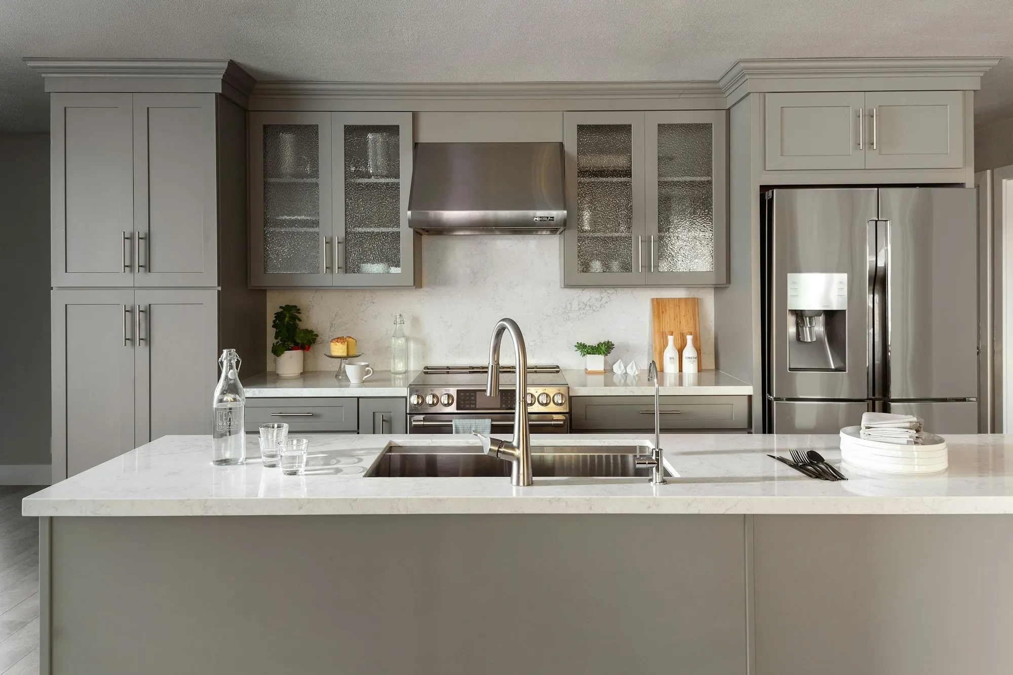 Gray kitchen with a large island and stainless appliances