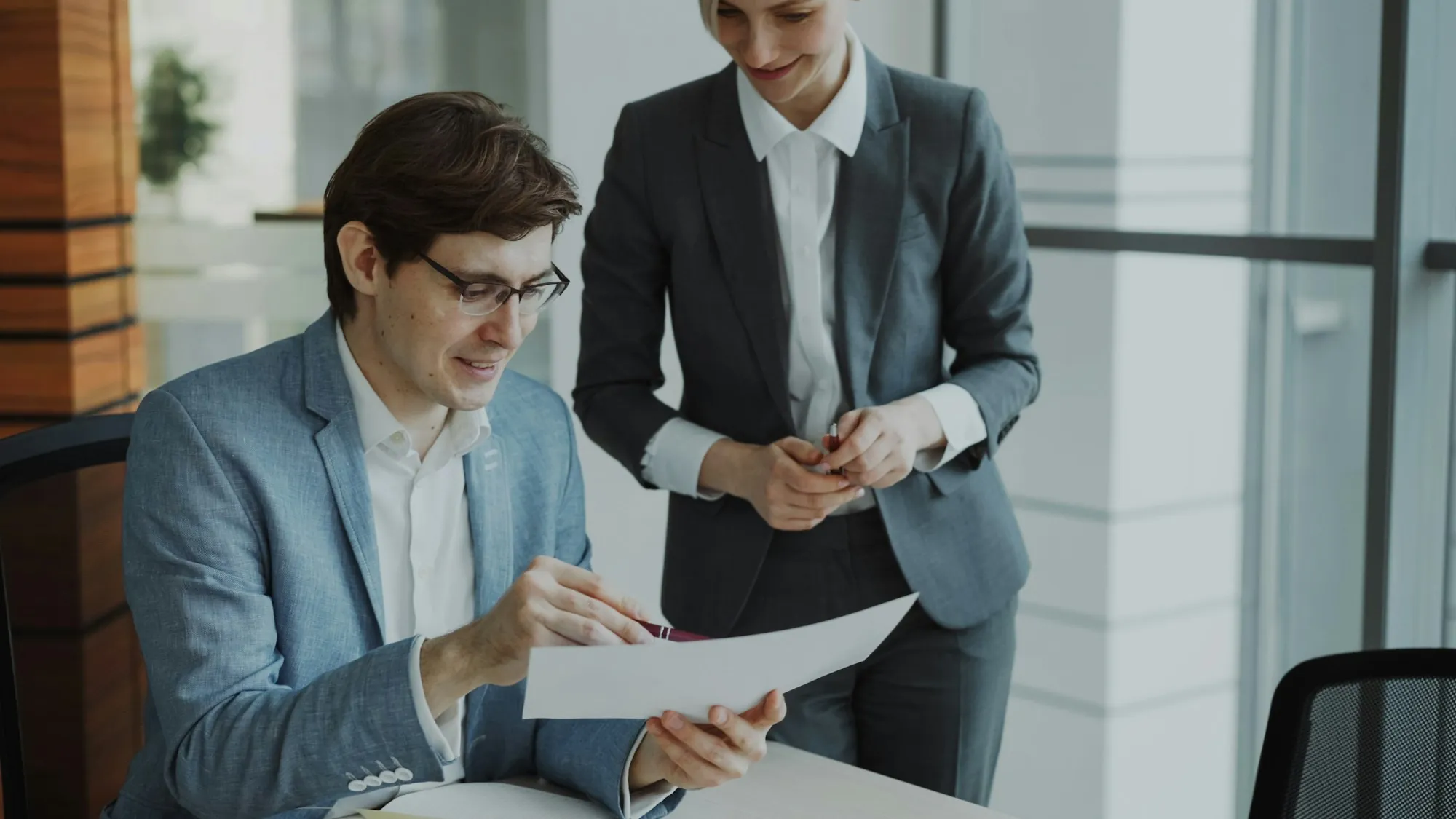 Two men reviewing a document together